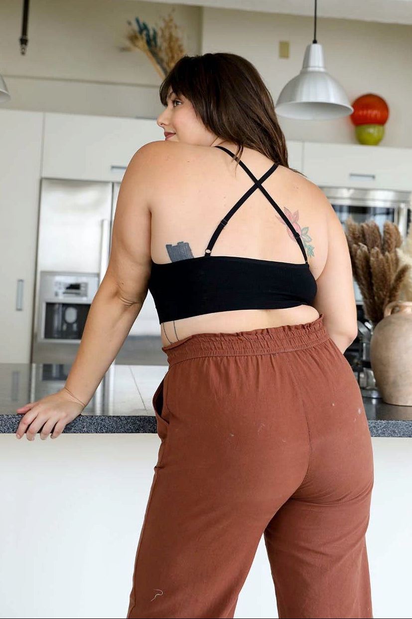 Crochet lace black bralette halter style with secure cross-back.