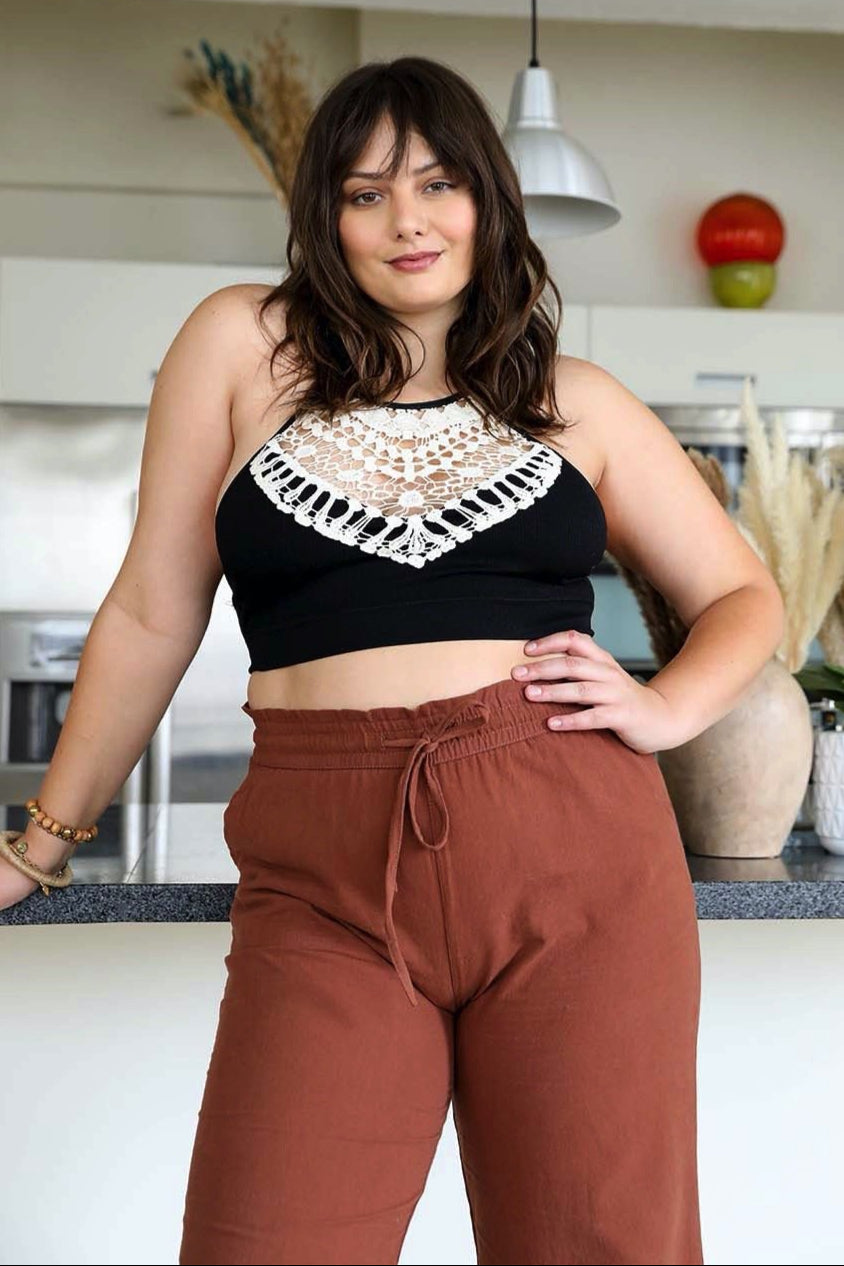 High-neck crochet black bralette with a lightweight and stretchy fit.