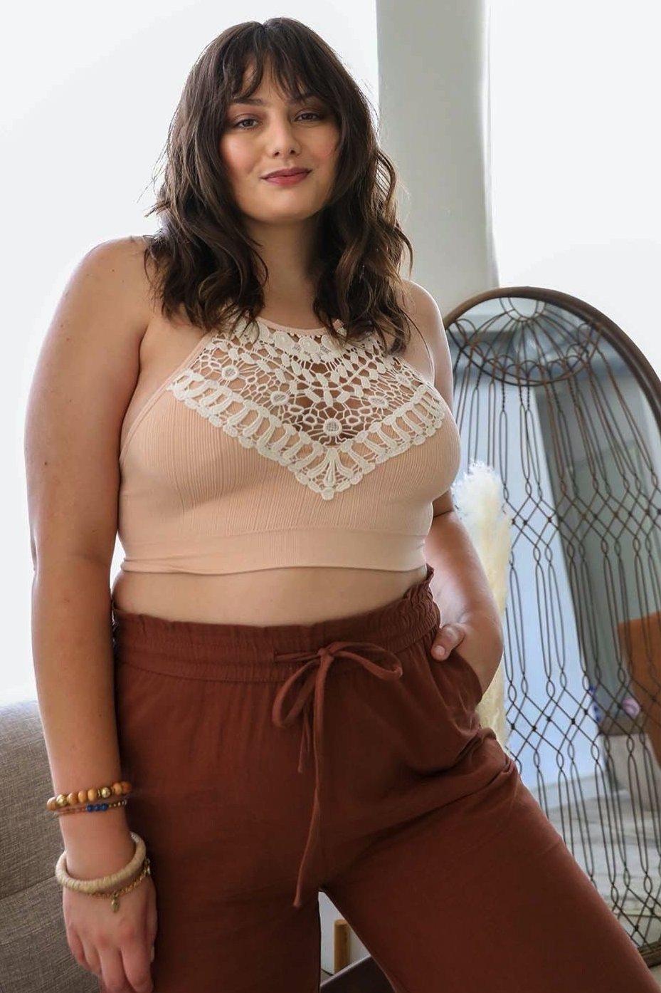 Elegant plus size blush bralette with crochet lace and halter neck.