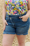 RISEN Maya Full Size Mid Rise Asymmetrical Shorts Denim Shorts Trendsi   