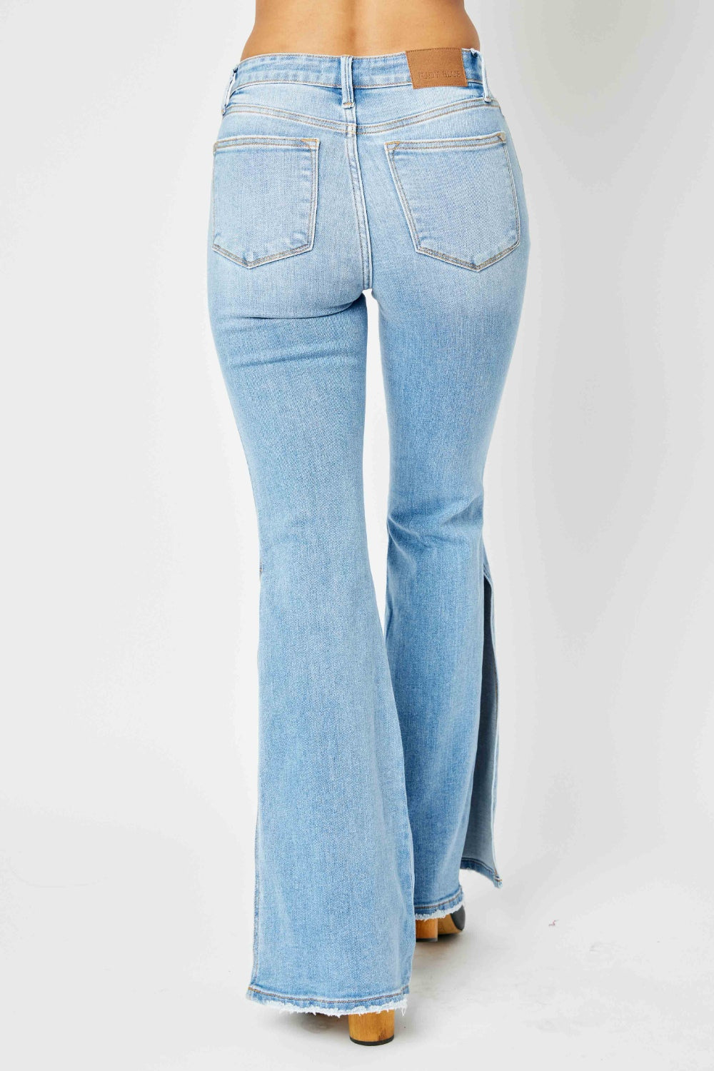 Judy Blue Full Size Mid Rise Raw Hem Slit Flare Jeans Jeans Trendsi   